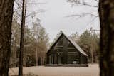 A striking black exterior with a myriad of windows.