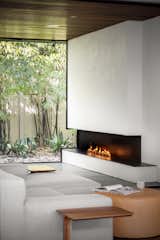A lit fireplace in the urban patio.