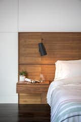 A custom walnut bed was designed for the master bedroom.