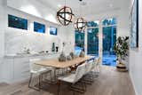 Dining Room, Chair, Ceiling Lighting, Porcelain Tile Floor, Bar, Storage, and Pendant Lighting Dining Room  Photo 13 of 16 in Monarch by Liz Reid