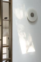 Architectural wood partition seamlessly integrated with load-bearing wall elements.