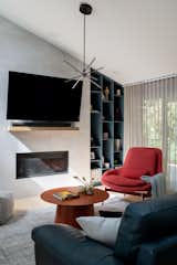 Custom open built-in bookcase in the niche at the fireplace wall. 
