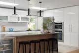Kitchen peninsula offers a seamless transition from prep space to casual seating