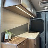No propane, all solar to power lights water and induction stove with pop up outlet! 