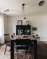 Dining Room, Chair, Table, and Dark Hardwood Floor  Photo 7 of 10 in The Moody Home by Photographie Intérieure CO.