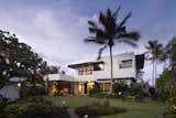 Exterior, House Building Type, Beach House Building Type, Metal Roof Material, Stucco Siding Material, Flat RoofLine, and Wood Siding Material Exterior Front View  Photo 1 of 24 in Ocean Retreat Along Waimanalo Coast, Hawaii by Maile Kop