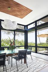 Dining Area with Ocean Views: Waves, sun, and views of Mānana Island complete the kitchen and dining space.