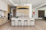 Open concept kitchen area with wood accents