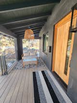 Newly un-enclosed patio features sliding front gate for pets and privacy