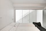 Bedroom, Wardrobe, and Concrete Floor Guest Beds  Photo 5 of 8 in House White by Archiplus International Limited