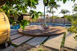 Circular deck is a favorite family gathering spot and offers views to every angle of backyard.