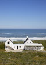 Exterior, House Building Type, A-Frame RoofLine, Concrete Siding Material, and Metal Roof Material Exterior of property  Photo 1 of 23 in Varswaterbaai by Charlotte