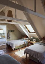 Bedroom, Bed, Night Stands, Pendant Lighting, and Travertine Floor Attic bedroom  Photo 11 of 23 in Varswaterbaai by Charlotte