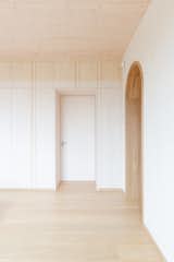 Whitewashed wood - oak flooring and door frames - white clay plaster walls