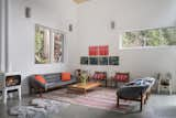 Living Room, Chair, Concrete Floor, Sofa, Wall Lighting, and Gas Burning Fireplace Living area
Vintage Arne Norell Sirocco Safari chairs, Vintage Trioh coffee tables , Vintage R. Huber sofa and chairs   Photo 9 of 12 in Tuwanek Forest Retreat by Sharif Senbel