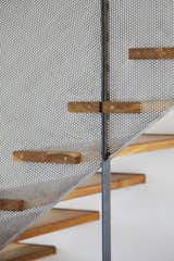 Staircase, Wood Tread, and Metal Railing Stairs  Photo 10 of 18 in Minnedosa House by design-built