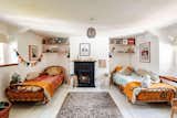 Bright and cosy furnishings in the children's room, with reclaimed timber and original features