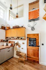 A ceiling was removed to create additional light and space in the double height kitchen