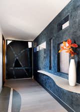 Entry highlighting the metal pivot door that can open to give access to the Library