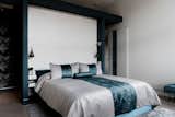 Primary Bedroom with built in nightstands and reading pendants.