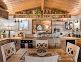 The tiny, but expansive, kitchen almost smells like lentil soup upon first glance. Mixed nuts with crackers make for an engaging center piece when company is over. Everything is within arms reach, including the one open shelving for the plates and bowls. Comes in handy when you're stuck stirring a pot and need to grab a dish!