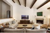 Living Room, Console Tables, Sofa, Gas Burning Fireplace, Corner Fireplace, and Travertine Floor Tabarka Studio Fireplace Tile Surround  Photo 3 of 12 in 1000 Feet Above Sea Level by Gillian Jones