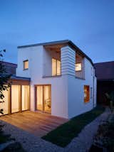 Exterior, Shed RoofLine, Stucco Siding Material, House Building Type, Metal Roof Material, and Wood Siding Material  Photo 11 of 29 in House in the Courtyard by IGLOO ARCHITEKTI