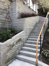 Stepped concrete foundation leading to the home entrance. 