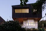 Exterior, Wood Siding Material, House Building Type, and Metal Roof Material A new addition rests upon the original bungalow structure  Photo 11 of 21 in The Balmoral Beach House by Queen Mab Design Studio