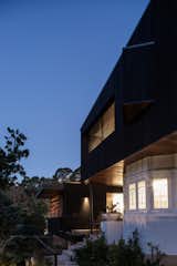 Exterior, Wood Siding Material, Metal Roof Material, and House Building Type A dusk view of the north facade  Photo 12 of 21 in The Balmoral Beach House by Queen Mab Design Studio