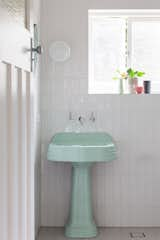 Bath Room, Wall Lighting, Pedestal Sink, Porcelain Tile Floor, and Subway Tile Wall An original basin is retained  Photo 19 of 21 in The Balmoral Beach House by Queen Mab Design Studio