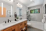 Bath Room, Engineered Quartz Counter, Undermount Sink, Porcelain Tile Floor, Soaking Tub, and Ceramic Tile Wall Newly remodeled bathrooms  Photo 4 of 8 in El Cerrito Mid Century by Cynthia Speers