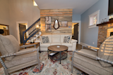 Living Room, Sofa, End Tables, Coffee Tables, Floor Lighting, Vinyl Floor, Ceiling Lighting, Gas Burning Fireplace, Bookcase, and Chair Living Area  Photo 4 of 6 in The Tiny Red Barn by Virginia Birstler