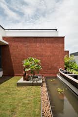 Outdoor, Lap Pools, Tubs, Shower, Trees, Grass, Stone Fences, Wall, Garden, Landscape Lighting, and Side Yard  Photo 14 of 35 in House with Hidden Gardens by Hrishikesh More Architects