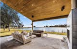 Outdoor living area with fireplace on lake 