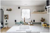 To capture more light into the space, we added a window in the kitchen and revealed the window that was hiding in the bunk area.