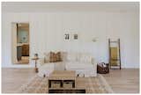 Board and battten cottage inspired living room with rich texture