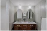 Walnut double vanity and tile shower surround