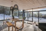 Dining room overlooking the living room  Photo 9 of 44 in The Scandinavian on a Pond by Construction Memphré