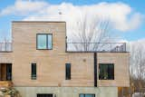 Exterior, Wood Siding Material, Flat RoofLine, and House Building Type  Photo 11 of 34 in The bi-generational home by the mountain by Construction Memphré