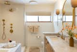 Primary bath shower AFTER- with Kohler fixtures, including a rain shower, and Mr. Steam steam shower functionality. Donna Karan linens, Anthropologie lighting sconces, custom insulated blackout blinds by Hunter Douglas, and a TOTO Bidet toilet