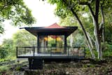 Exterior, Cabin Building Type, Glass Siding Material, House Building Type, Flat RoofLine, Metal Siding Material, Farmhouse Building Type, Wood Siding Material, and Metal Roof Material  Photo 1 of 23 in An Off-Grid Cabin Wrapped in Glass Hunkers in a Hawaiian Forest from Glass House