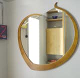 The custom-designed oversized 'Lyre' mirror brings space and lightness into the hallway.