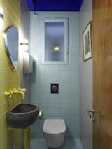 The ceiling in the small toilet appears so high that Little Greene's Ultra Blue was painted on it to bring it down. The colour is reminiscent of the sky at midnight.