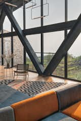 The structural members have been left bare to intentionally showcase the beauty and intricacies of concrete intersecting metal.