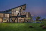 The view from the north garden. The metal structure cantilevers over the swimming pool 