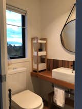 Bath Room, Wood Counter, Enclosed Shower, One Piece Toilet, Painted Wood Floor, and Recessed Lighting Master Bedroom Ensuite  Photo 11 of 14 in KUBO : Our Little House on a Hill by ais+udio