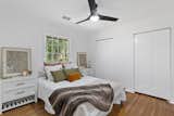 Bedroom, Bed, Ceiling Lighting, Night Stands, and Medium Hardwood Floor  Photo 9 of 14 in The Ranch Revival by Savannah Gordon