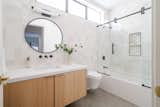 Bath Room, Marble Counter, One Piece Toilet, Medium Hardwood Floor, Soaking Tub, and Enclosed Shower  Photo 2 of 41 in Architectural Beauty in Venice | WJK Development | Listed by Juliette Hohnen by Juliette Hohnen