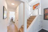 After: Open Stairwell and Guest Wing
A closer look at the newly opened stairwell showcases the clean lines and natural light that now define the space. The view extends down a refreshed hallway leading to a fully updated lower-level guest room—modernized for comfort and style while maintaining a cohesive flow with the rest of the home.